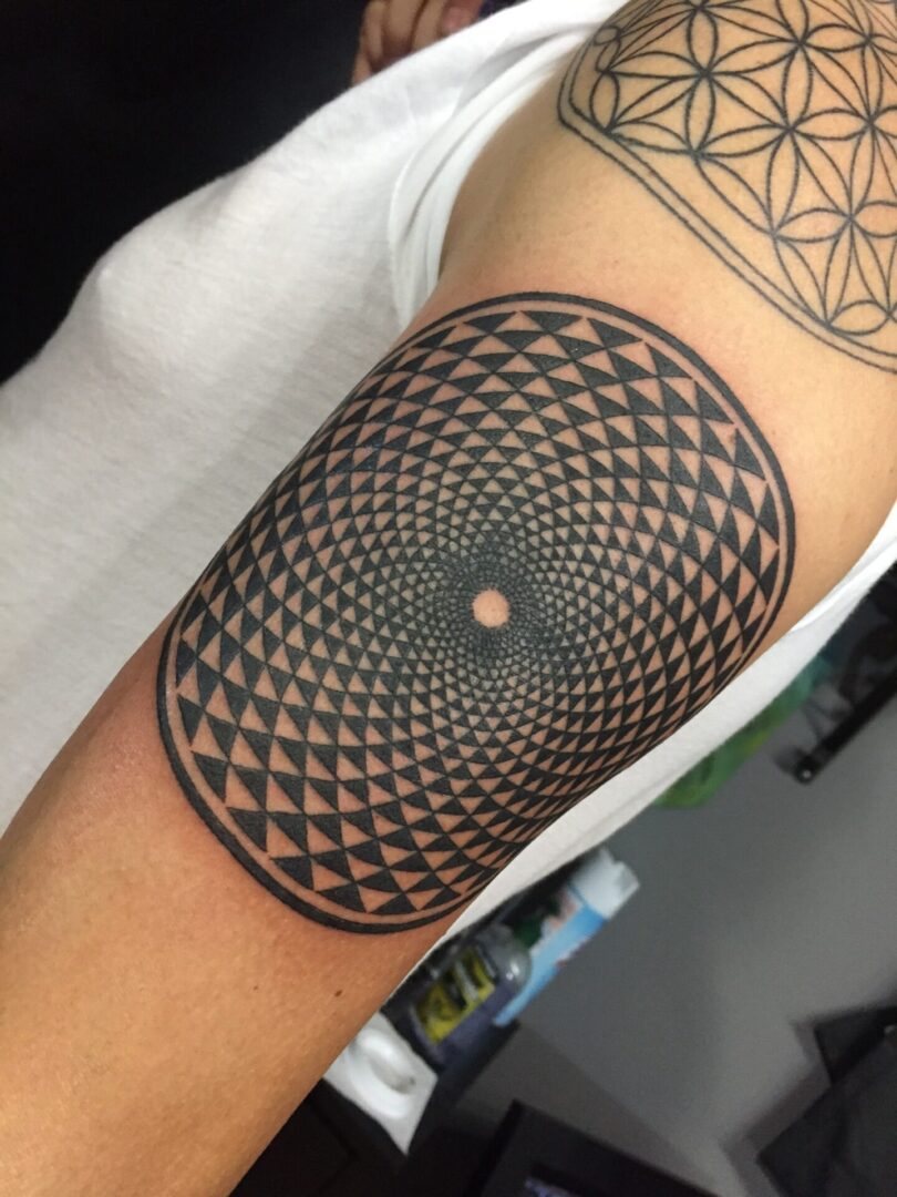 A tattoo of an intricate design on the arm.