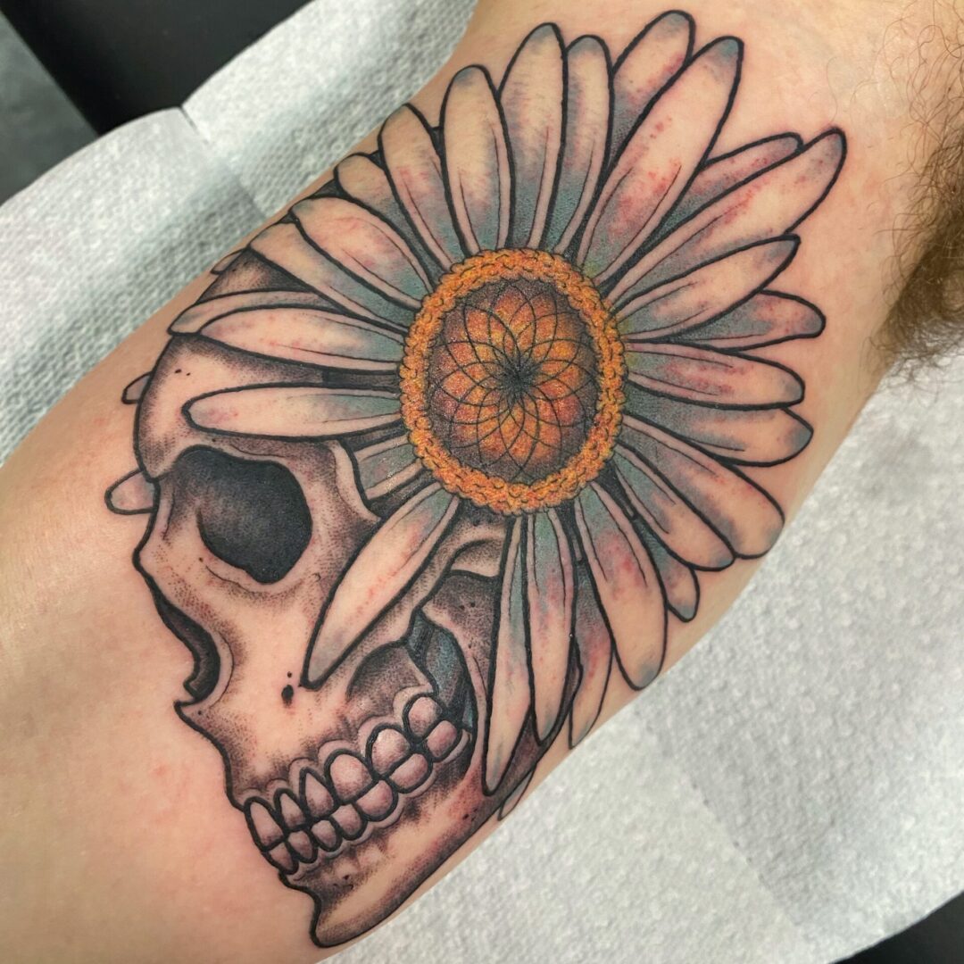 A skull with a flower on it's side