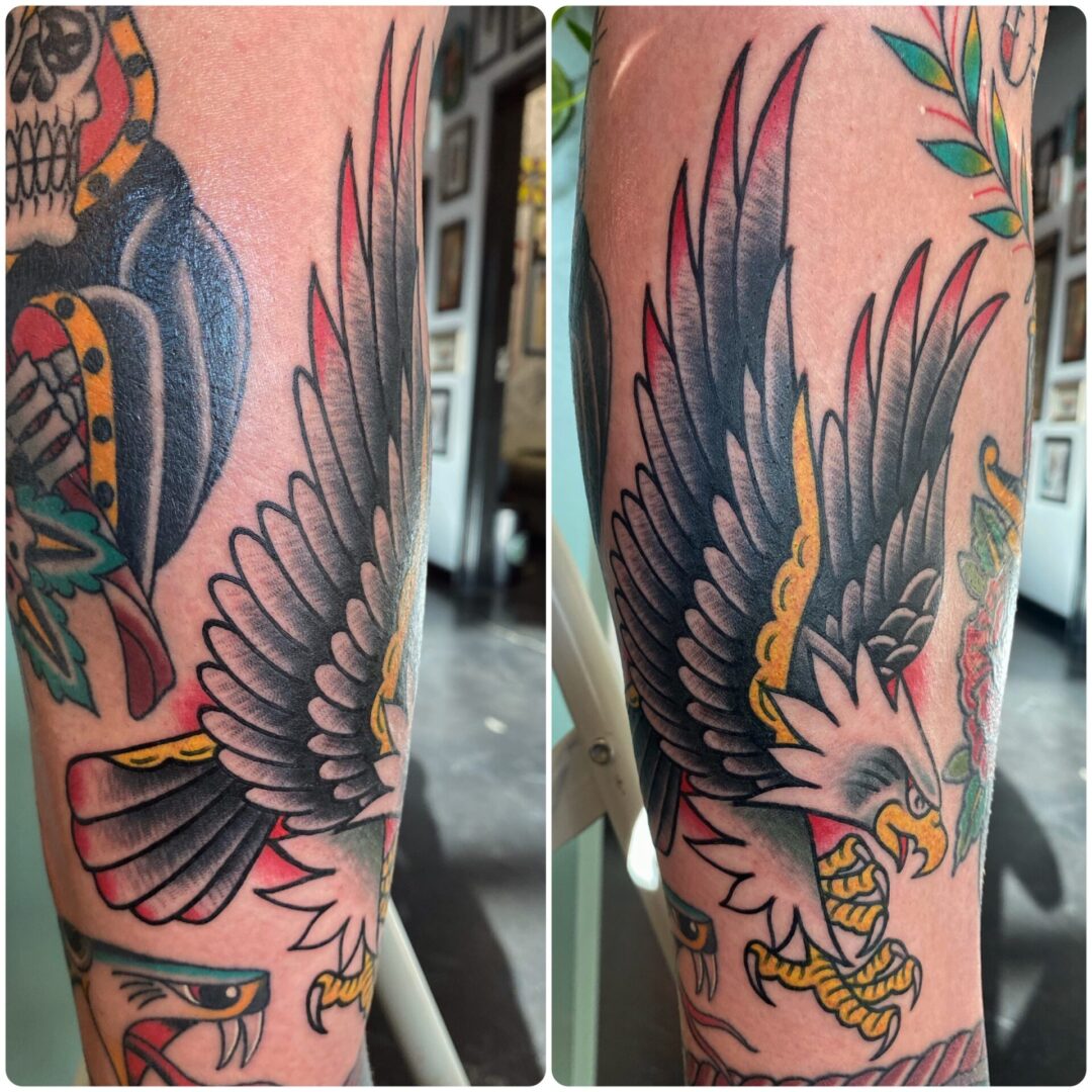 A tattoo of an eagle with its wings spread.