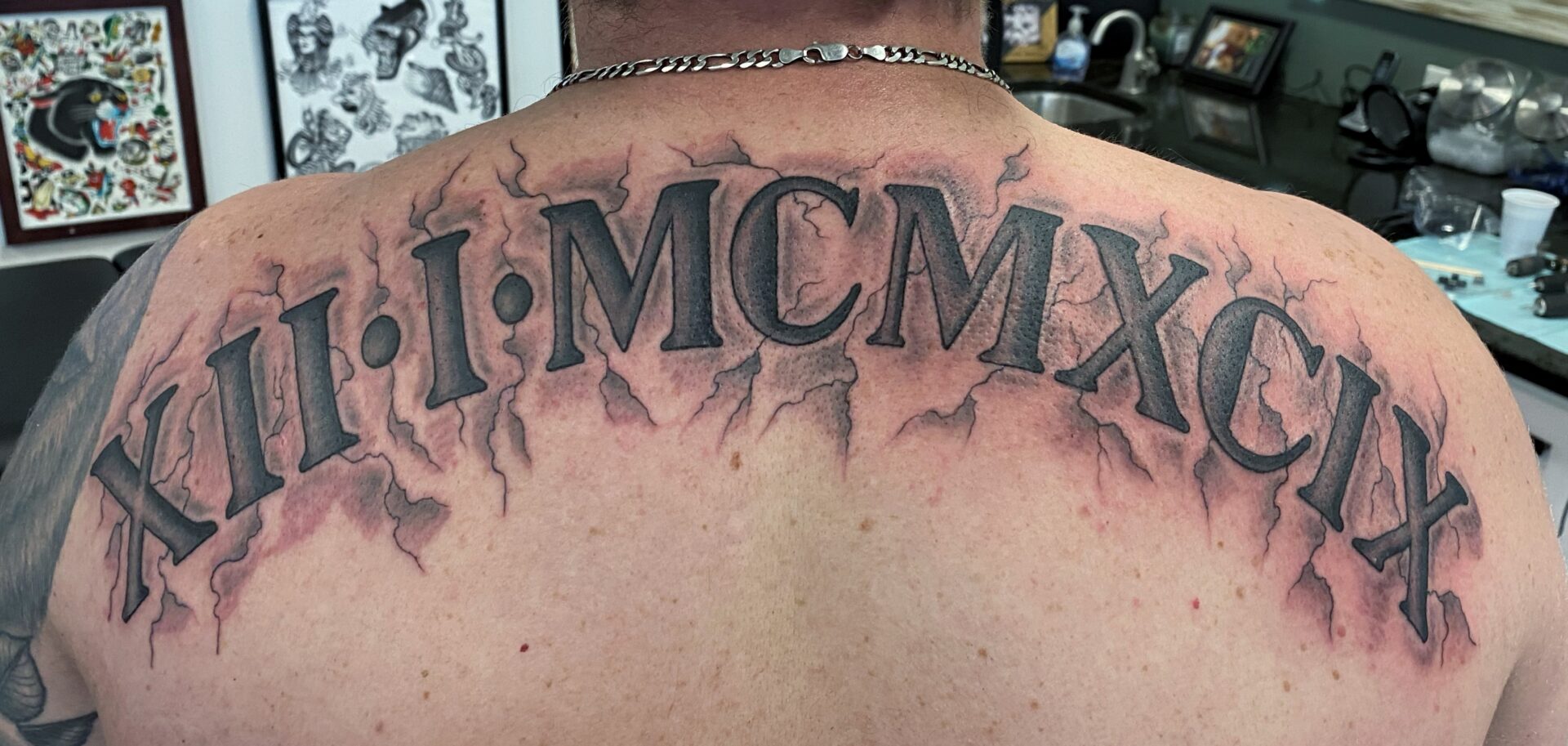 A man with a tattoo of the words 