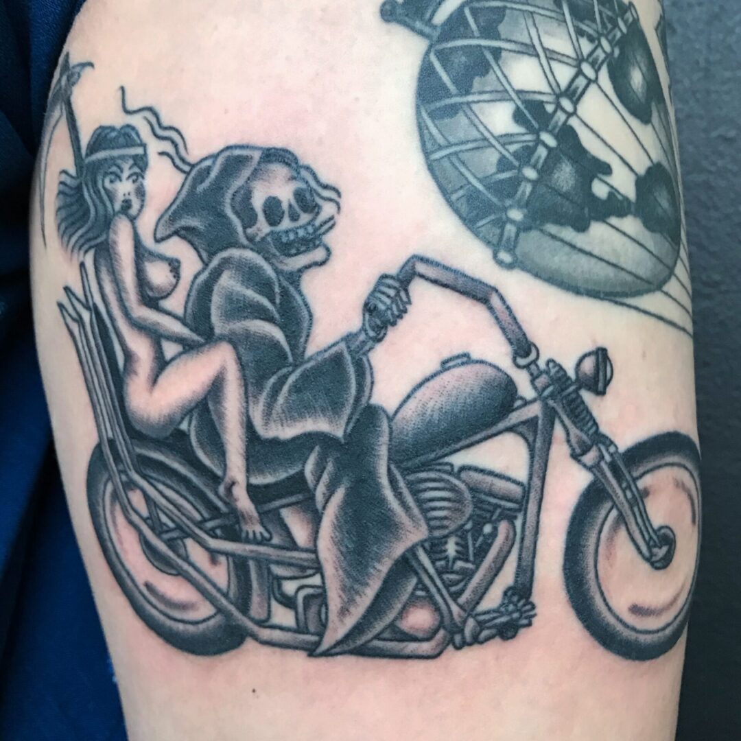 A skeleton on a motorcycle with a helmet and a globe in the background.