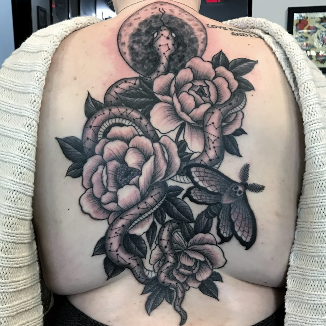 A woman with a tattoo on her back