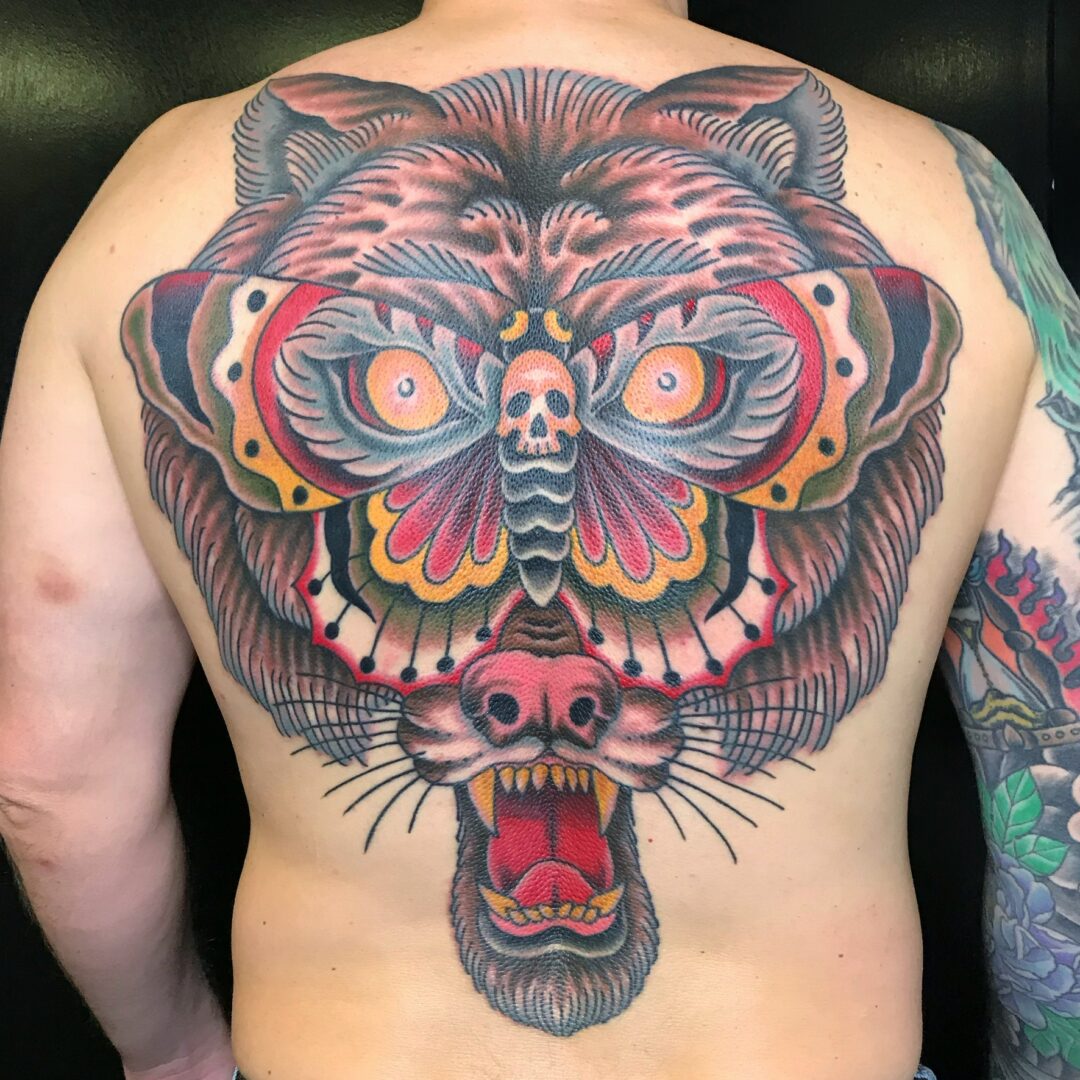 A man with a tattoo of a tiger head.