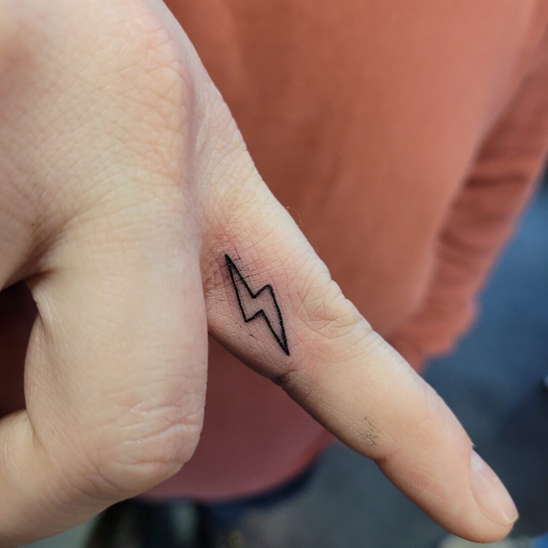 A person with their finger that is drawn on.